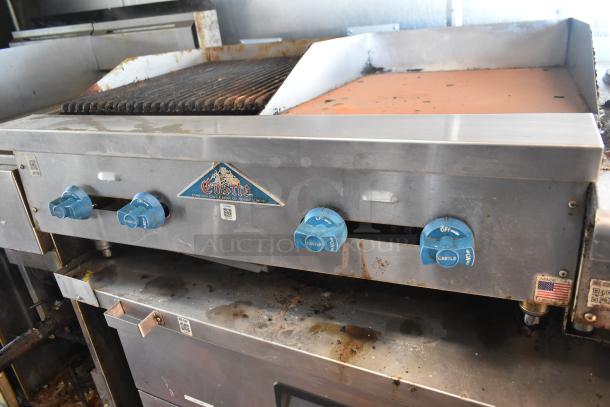 2019 Quality Cargo 8.5' x 24' mobile kitchen trailer interior, featuring a Castle stove with grease hood and blue control knobs.