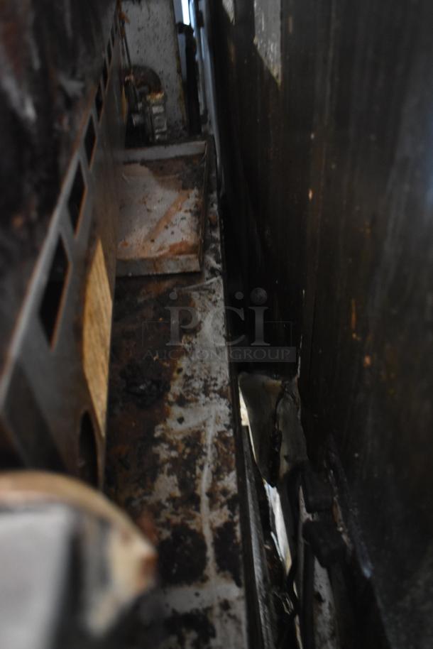 2019 Quality Cargo mobile kitchen trailer internal view showing grease buildup and equipment wear. VIN 50ZZ1E427KN012840.