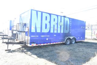 2020 Diamond Cargo 8.5' x 24' mobile kitchen trailer with grease hood, refrigeration, fryers, griddle. Blue exterior with "NBRHD" branding.