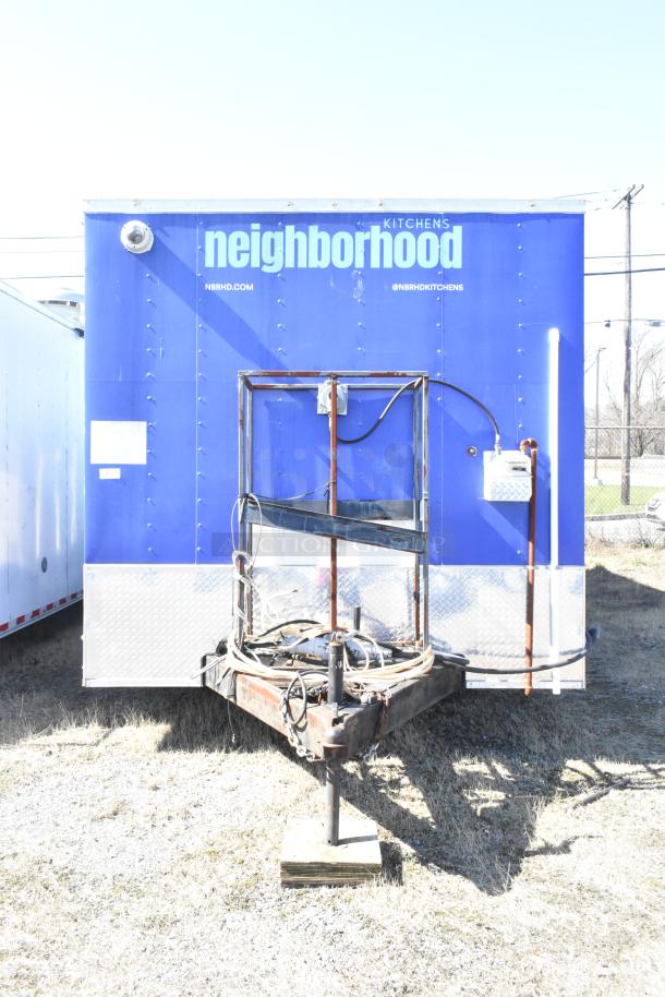 2020 Diamond Cargo 8.5' x 24' mobile kitchen trailer, blue exterior, fitted with grease hood, refrigeration, fryers, and griddle.