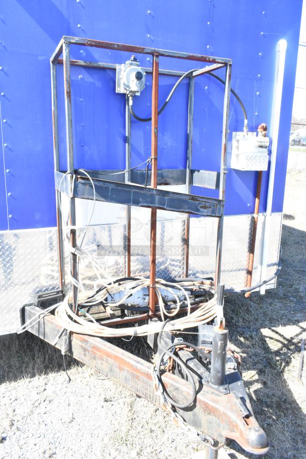 2020 Diamond Cargo mobile kitchen trailer with blue exterior, visible hitch, and electrical connections.