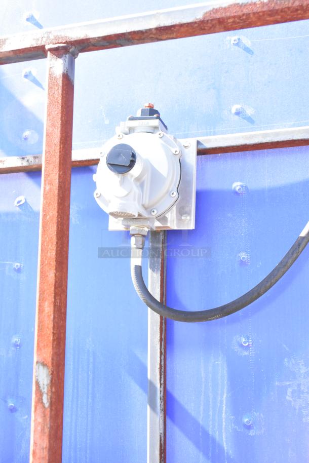 Electrical outlet on blue exterior of the 2020 Diamond Cargo 8.5' x 24' mobile kitchen trailer.