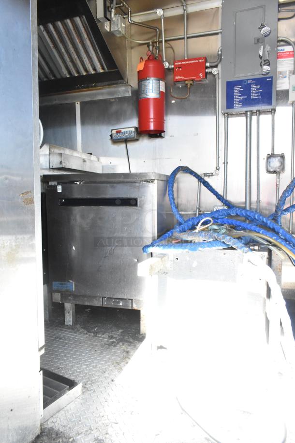 2020 Diamond Cargo 8.5' x 24' mobile kitchen trailer interior with grease hood, refrigeration, fryers, and griddle.