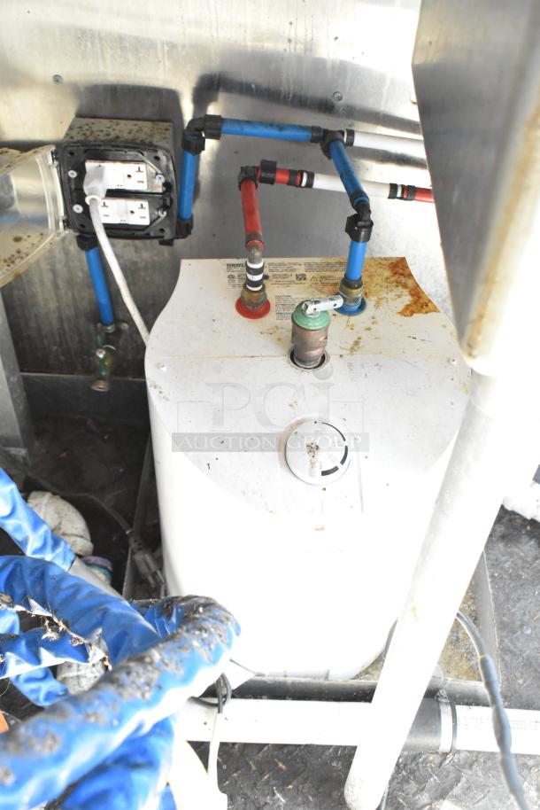 Interior view of 2020 Diamond Cargo mobile kitchen trailer showing plumbing connections and electrical outlets, indicating functional setup.