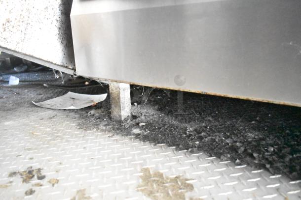 Diamond Cargo 2020 mobile kitchen trailer underside. Features grease hood, refrigeration, fryers, and griddle. Fully outfitted.