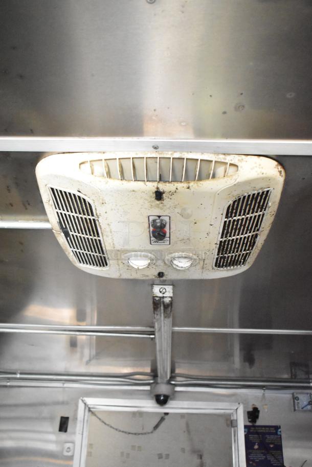 Interior view of 2020 Diamond Cargo mobile kitchen trailer showing ventilation system. Visible grease buildup on vent.