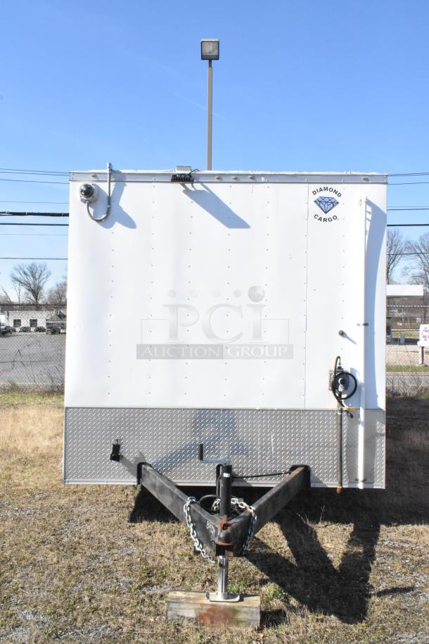 2021 Diamond Cargo 8.5' x 24' food trailer, features grease hood, AC system, and clear Diamond Cargo branding.