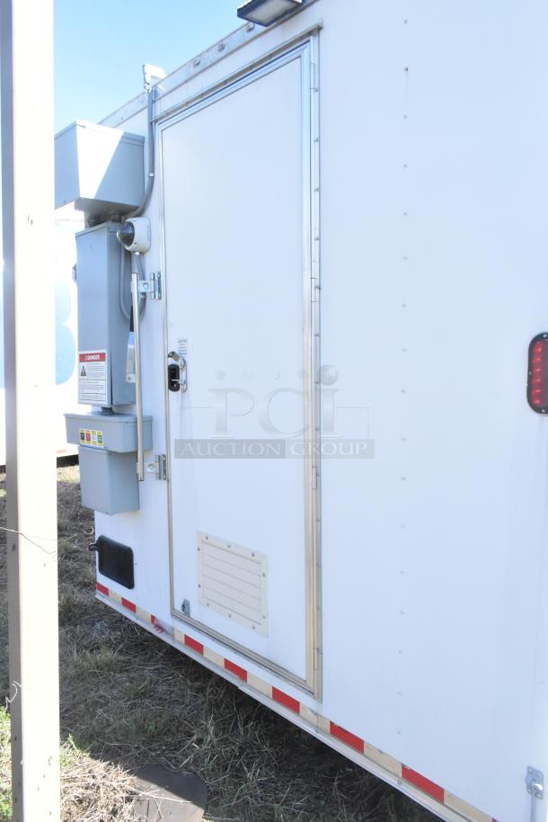 2021 Diamond Cargo 8.5' x 24' food trailer with grease hood, AC system, and safety labels. Side door view, VIN 53NBE2424M1089724.