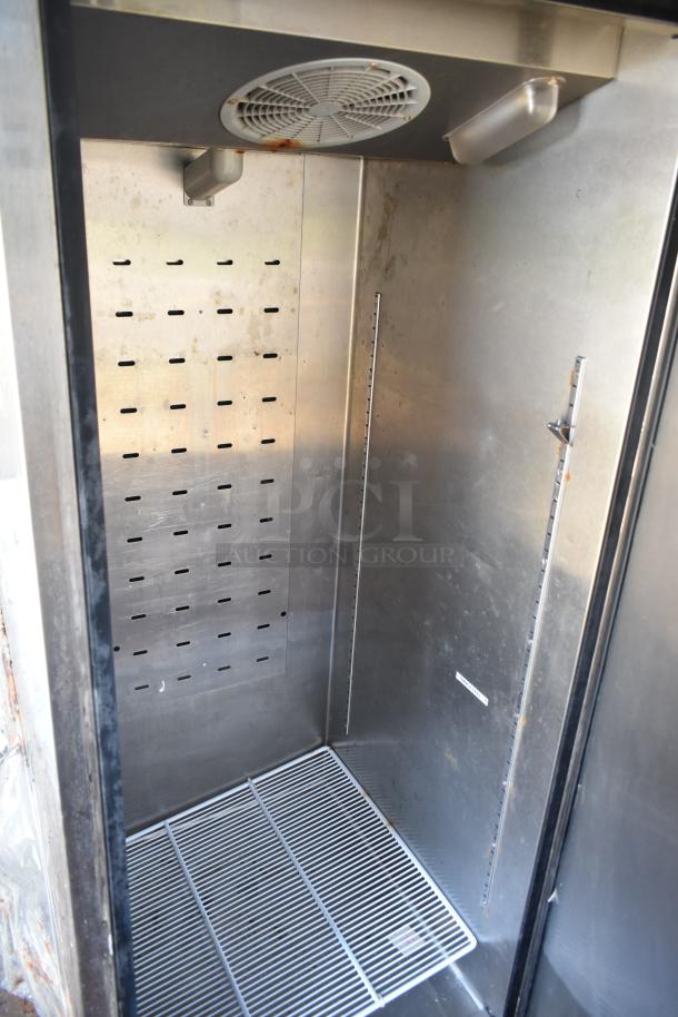 2012 Quality Cargo food trailer interior, stainless steel shelving, and ventilation fan visible, used condition.