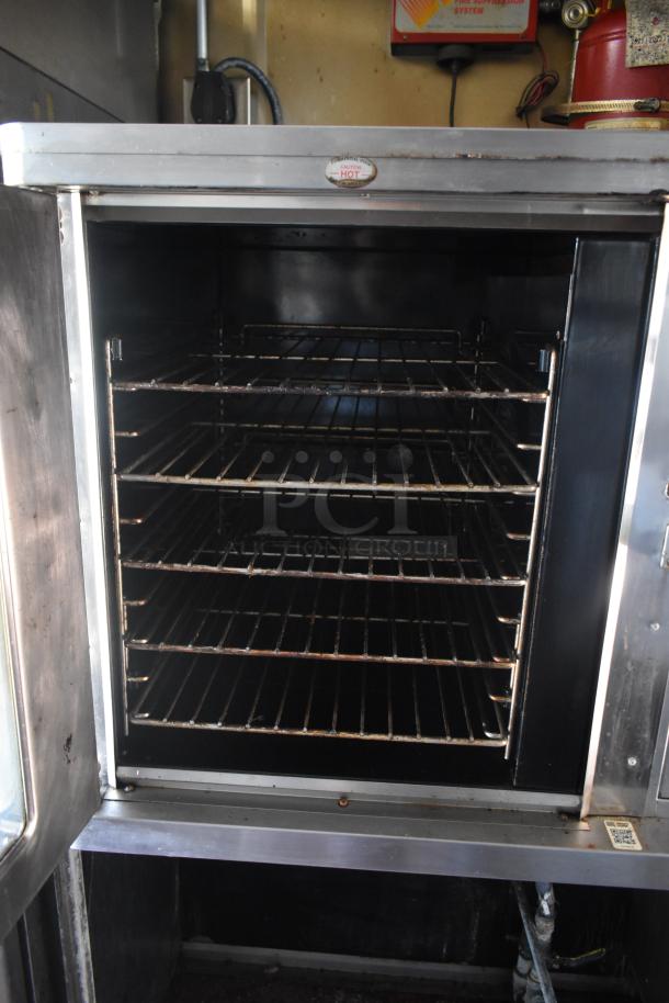 2012 Quality Cargo food trailer with Blodgett oven, dual fryer, and pizza prep. Features VIN 50ZZ1E427KN012840.