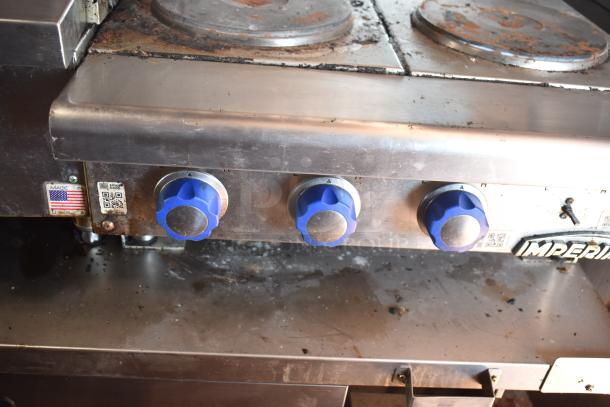 2012 Quality Cargo food trailer with Blodgett oven controls, showing blue knobs and wear, model VIN 50ZZ1E427KN012840.