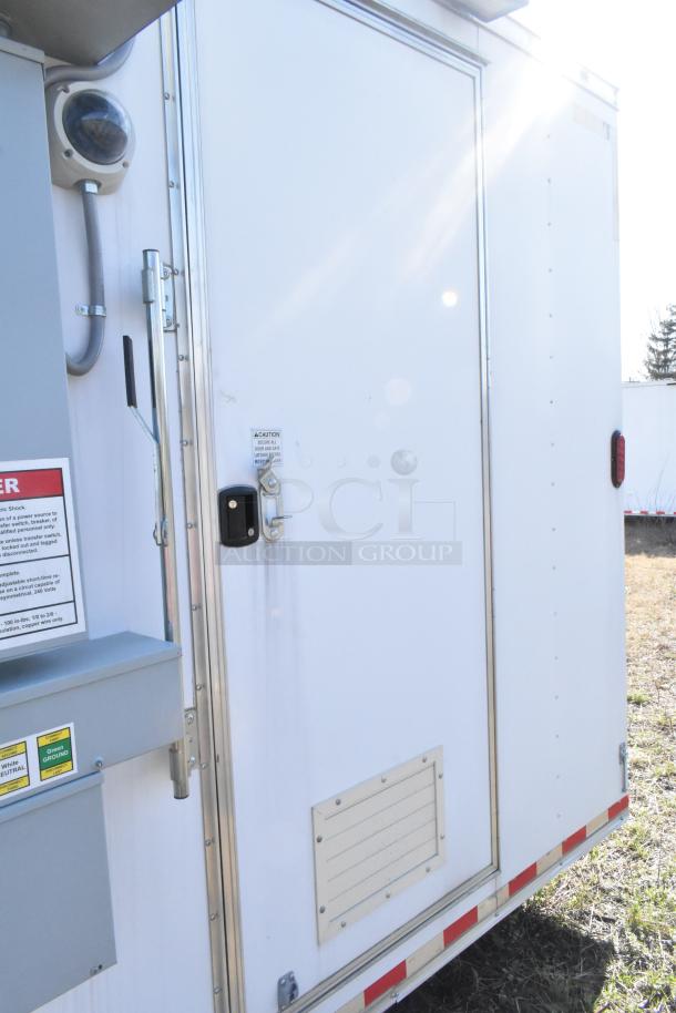 2021 Diamond Cargo 8.5' x 24' food trailer, features grease hood and AC system, VIN 53NBE2424M1089724. White exterior.