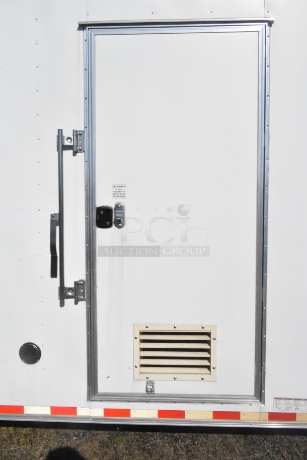 2021 Diamond Cargo 8.5' x 24' food trailer with grease hood, air conditioning, white exterior, and secure door handle.