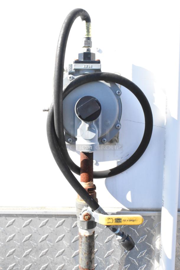 Gas regulator and valve on 2021 Diamond Cargo 8.5' x 24' food trailer, includes grease hood and AC system.