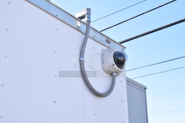 2021 Diamond Cargo 8.5' x 24' food trailer, includes grease hood, AC system. Features visible Avigilon security camera. VIN 53NBE2424M1089724.