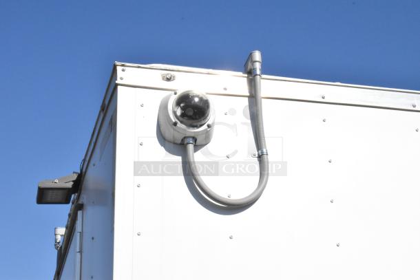 2021 Diamond Cargo 8.5' x 24' food trailer with visible camera and wiring on exterior. Includes grease hood and A/C system.