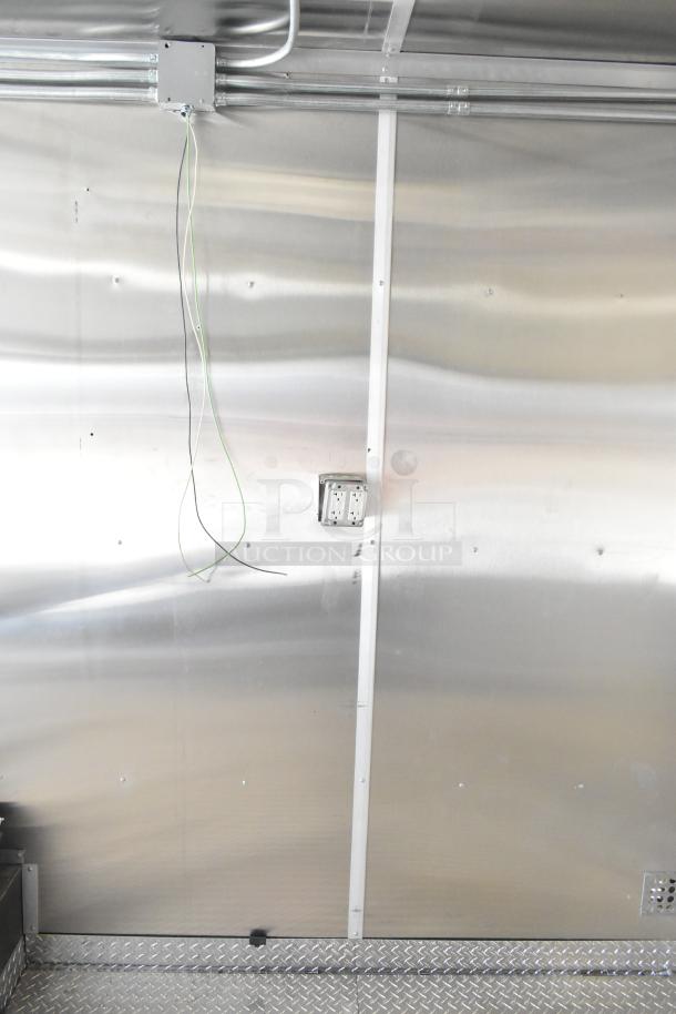 2021 Diamond Cargo 8.5' x 24' food trailer interior, featuring wired outlets, grease hood, air conditioning system. VIN 53NBE2424M1089724.