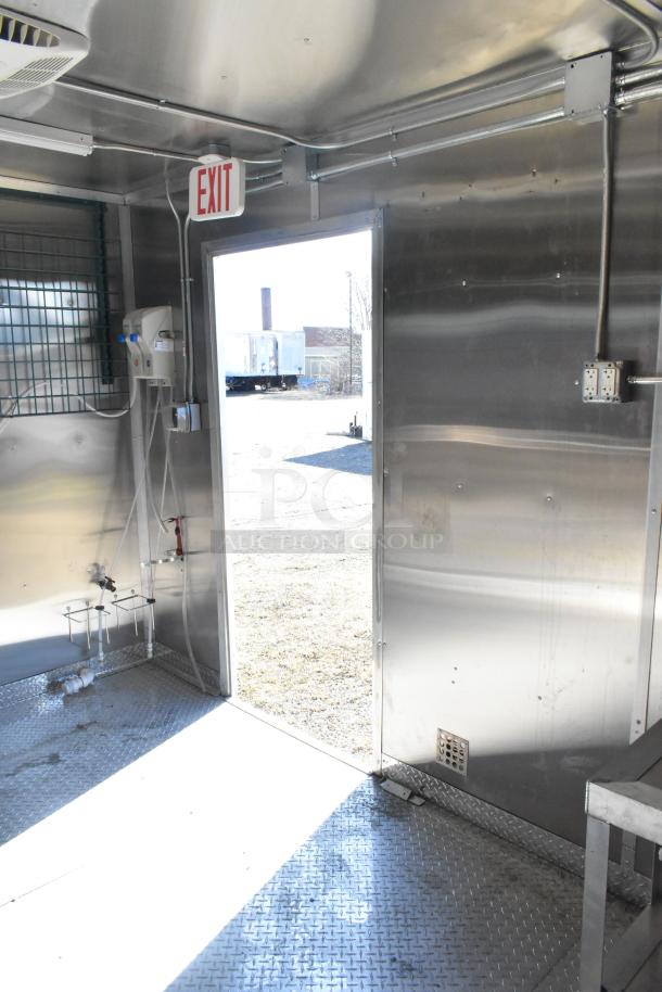 2021 Diamond Cargo 8.5' x 24' food trailer interior with grease hood and air conditioning system, stainless steel walls.