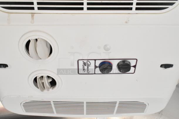 Interior air conditioning unit controls in the 2021 Diamond Cargo 8.5' x 24' food trailer, featuring Coleman-Mach settings.