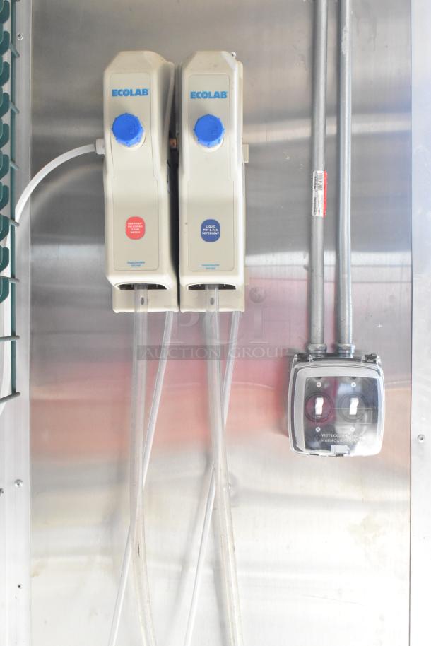 Ecolab dispensers in 2021 Diamond Cargo 8.5' x 24' food trailer. Clean stainless steel surface, equipped with necessary utilities.