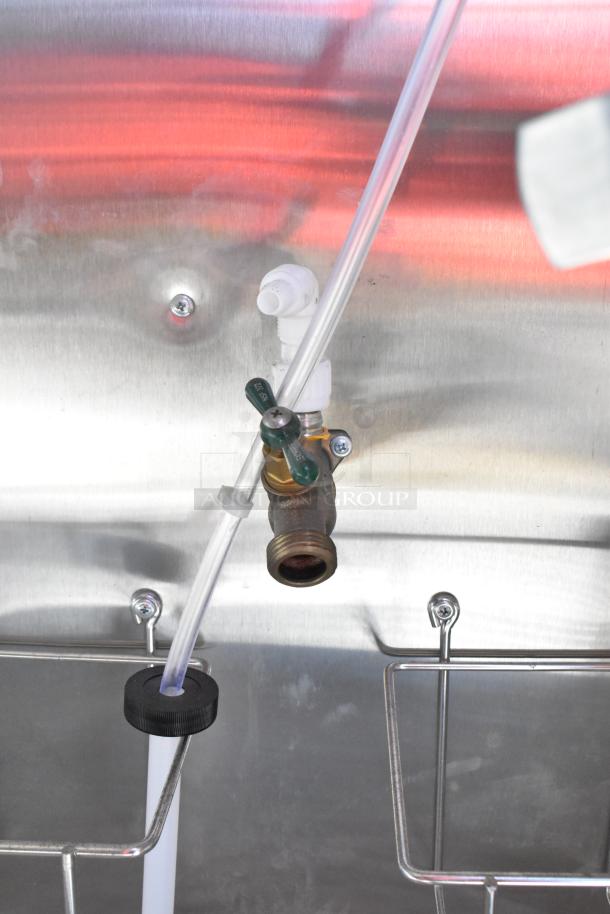 Close-up of plumbing inside the 2021 Diamond Cargo 8.5' x 24' food trailer, showing a valve and tubing system.