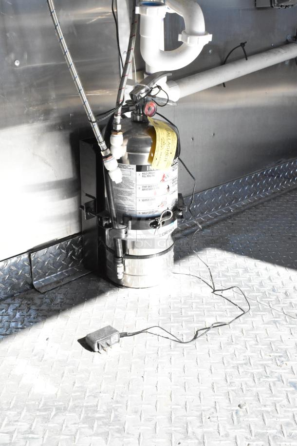 2021 Diamond Cargo 8.5' x 24' food trailer interior with grease hood, air conditioning, and metal flooring.