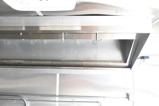 2021 Diamond Cargo 8.5' x 24' food trailer interior, featuring stainless steel grease hood and air conditioning system.