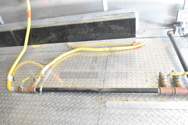 2021 Diamond Cargo 8.5' x 24' food trailer interior showing grease hood, air conditioning, and metal flooring.