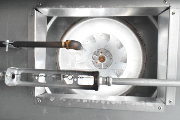Close-up of the ventilation system inside a Diamond Cargo food trailer, featuring metal ductwork and a central fan component.