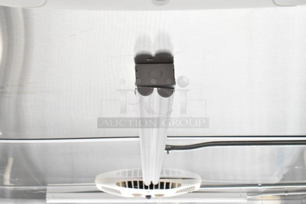 2021 Diamond Cargo 8.5' x 24' food trailer interior, showing grease hood and ceiling-mounted air conditioning system.