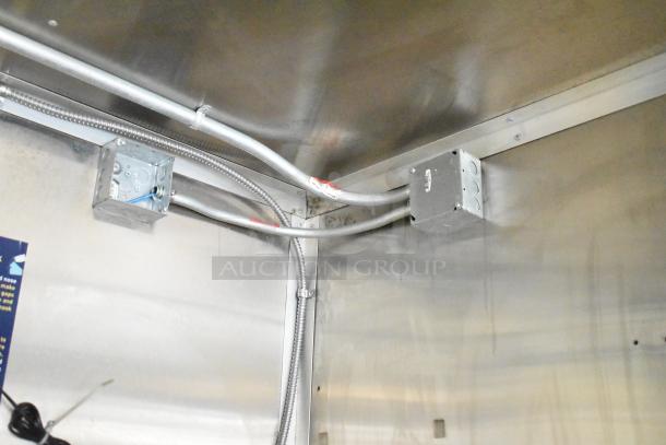 Interior view of 2020 Diamond Cargo mobile kitchen trailer, showcasing electrical wiring and junction boxes.