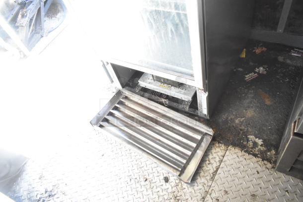 2020 Diamond Cargo mobile kitchen trailer interior showing grease hood and flooring. Features catering fridge, evident wear.