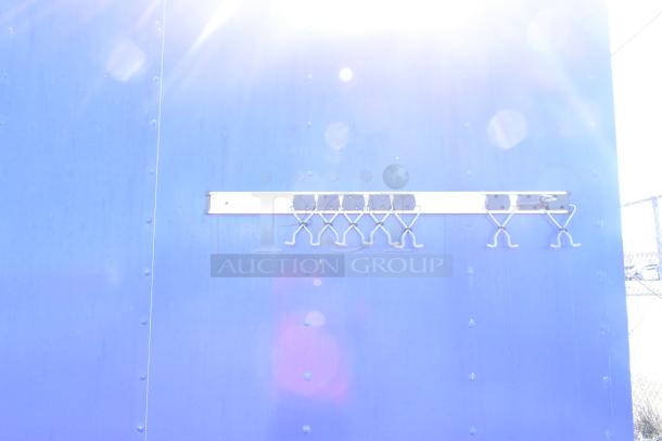 2020 Diamond Cargo mobile kitchen trailer, blue exterior, wall-mounted utility rack, VIN 53NBE2424M1083695.