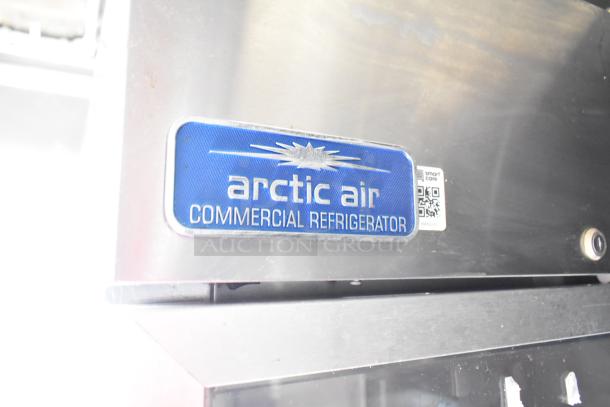 Arctic Air commercial refrigerator label on a 2020 Diamond Cargo mobile kitchen trailer with grease hood, refrigeration, fryers, and griddle.