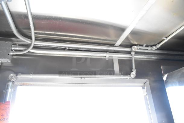 Interior piping of 2020 Diamond Cargo Mobile Kitchen Trailer, showing gas lines and electrical conduits, in excellent condition.