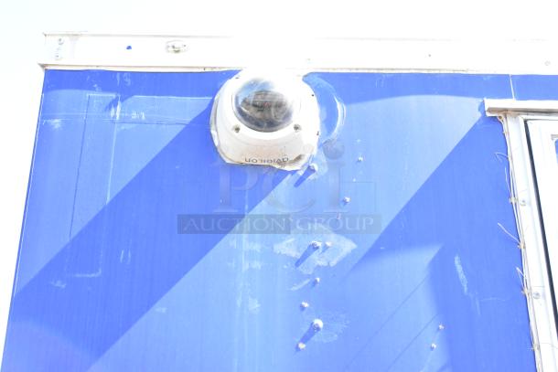 Blue exterior of 2020 Diamond Cargo mobile kitchen trailer, featuring a dome camera.