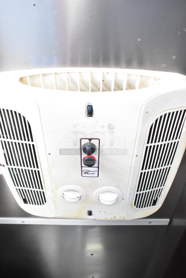 Interior vent hood of a 2020 Diamond Cargo 8.5' x 24' mobile kitchen trailer, featuring filters and dials.