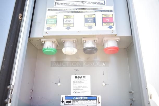 Electrical panel inside 2021 Diamond Cargo cold food trailer, showing labeled color-coded terminals.