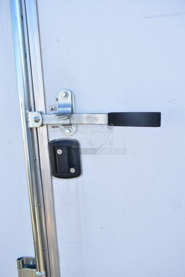 Lock mechanism on a 2021 Diamond Cargo 8.5' x 24' Cold Food & Beverage Fulfillment Trailer. VIN 53NBE2429M1089847.