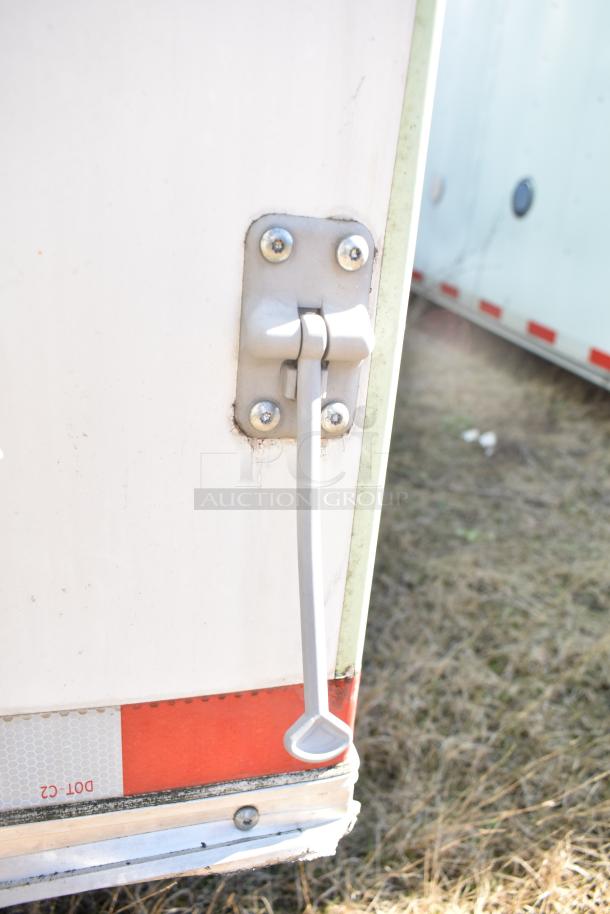 2021 Diamond Cargo 8.5' x 24' trailer door handle; VIN 53NBE2429M1089847 visible; durable condition.