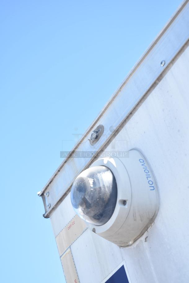 Close-up of security camera labeled Avigilon on a 2021 Diamond Cargo food and beverage trailer.