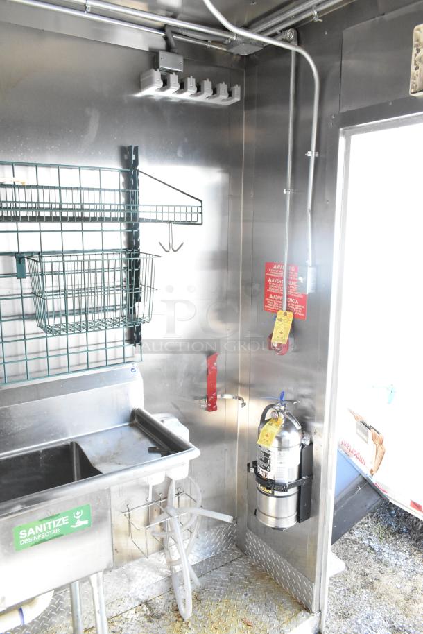 2021 Diamond Cargo 8.5' x 24' trailer interior; features sink, fire extinguisher, storage racks. Clean condition. VIN 53NBE2429M1089847.