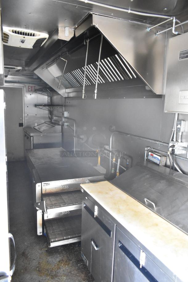 2021 Diamond Cargo 8.5' x 24' trailer interior, equipped for food and beverage service with stainless steel appliances. VIN 53NBE2429M1089847.