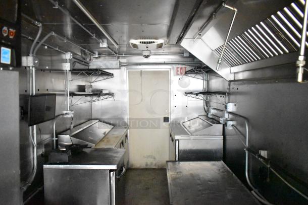 2021 Diamond Cargo 8.5' x 24' trailer interior, equipped for cold food and beverage fulfillment, stainless steel finish, shelves.