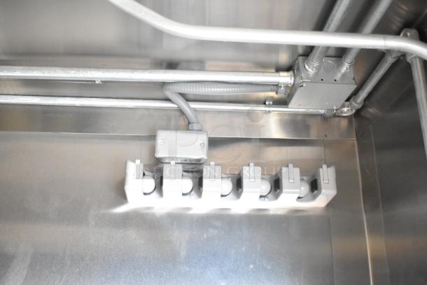 2021 Diamond Cargo 8.5' x 24' trailer interior showing electrical panel and conduit, stainless steel finish.