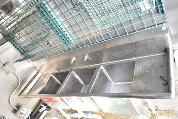 Stainless steel sink with three compartments, part of a 2021 Diamond Cargo 8.5' x 24' cold food trailer. Tags for wash, rinse, sanitize.