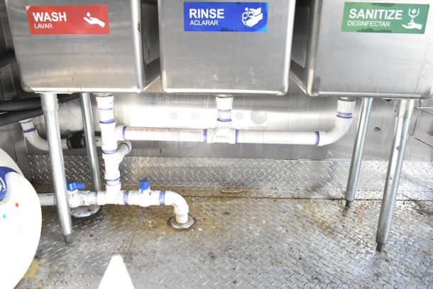 2021 Diamond Cargo trailer interior wash, rinse, and sanitize sinks with visible plumbing.