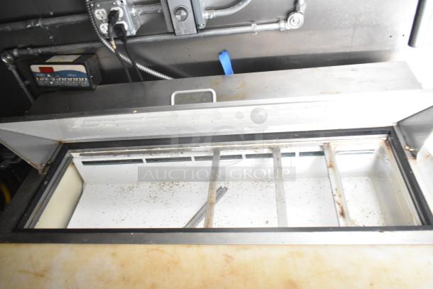 2021 Diamond Cargo cold food trailer interior, showing control panel and storage area. Some visible wear and debris.