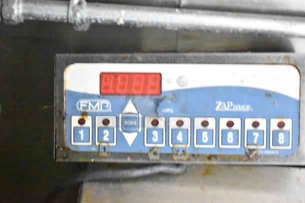 Exterior control panel of 2021 Diamond Cargo 8.5' x 24' cold food trailer. Features scan button and number keys 1-8.