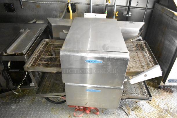 2021 Diamond Cargo 8.5' x 24' trailer interior, featuring stainless steel TurboChef ovens. Used for cold food/beverage fulfillment.